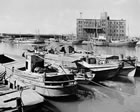 38 . BOATS IN A CANAL, OSAKA